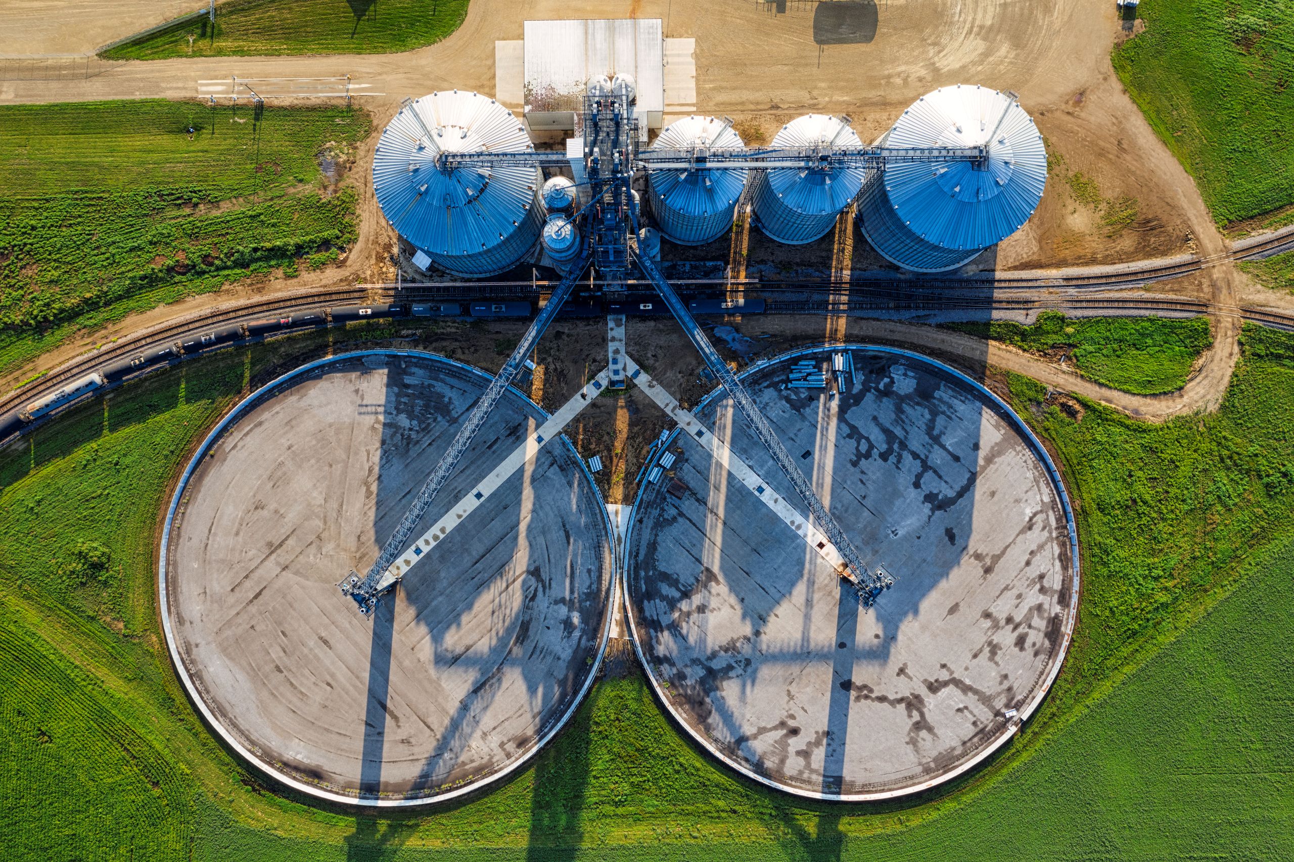 An aerial view of industrial silos and agricultural fields in rural Randolph, Minnesota.